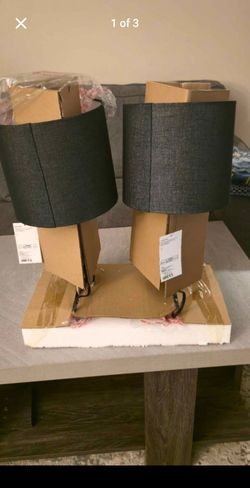 two new table lamps featuring black fabric drum shades