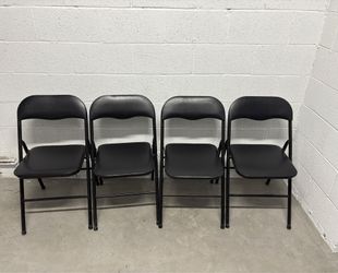 4 black metal chairs.