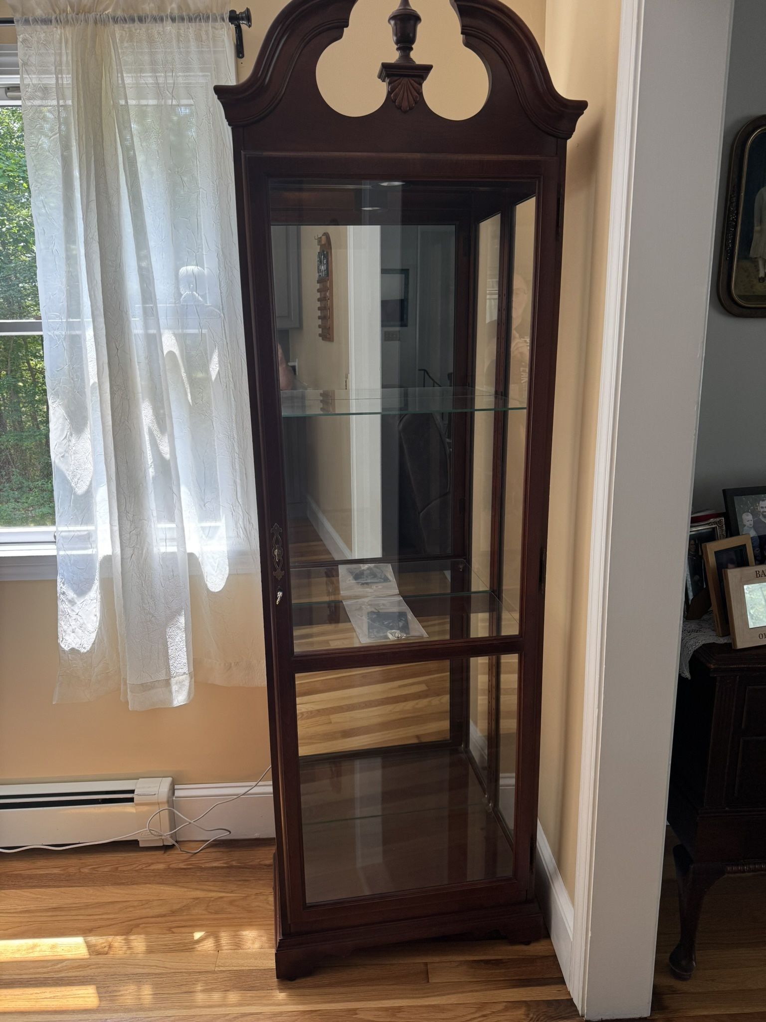 Curio Cabinet By Howard Miller