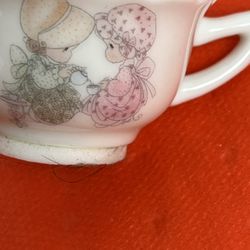 mini tea cup by Enesco is a precious moment from 1985, designed by Samuel J Butcher.
