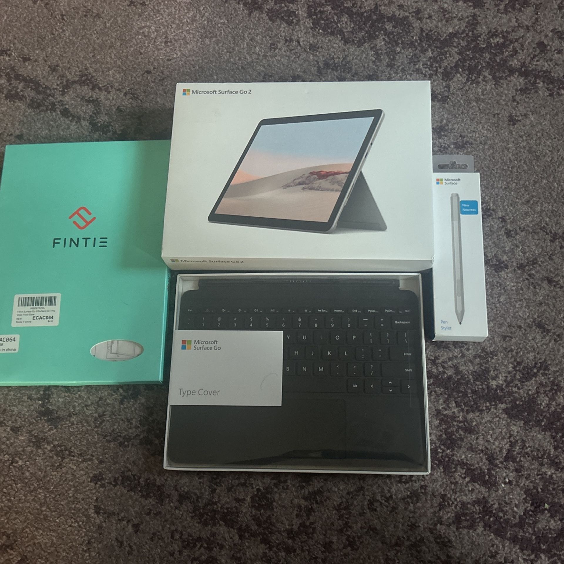Microsoft surface Go 2 laptop with charger, keyboard, case, and stylist pen