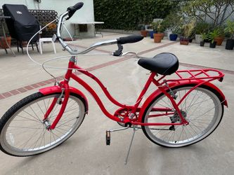 Red Schwinn cruiser bike