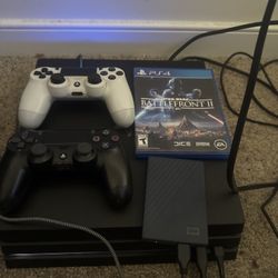 PS4 Pro Bundle (2TB Storage + 2 Controllers + Game) – $240 OBO
