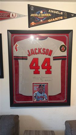 Autographed and Framed Reggie Jackson jersey