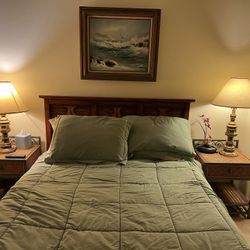 Queen Size Bed With End Tables and a Chest Of Drawers 