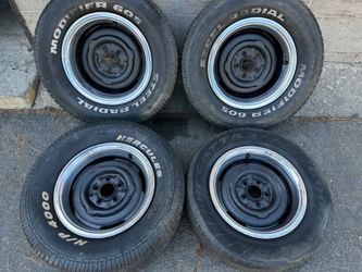 Staggered Mopar small pattern 14 inch steelies with old tires 5 on 4