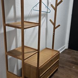 Clothing rack with Drawers for shoes.