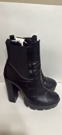 Black ankle boots with thick heels, also known as ankle boots with platform and block heel