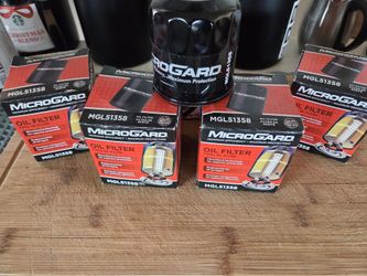 Microgard oil filters (4), plus a comparable Purolator oil filter.