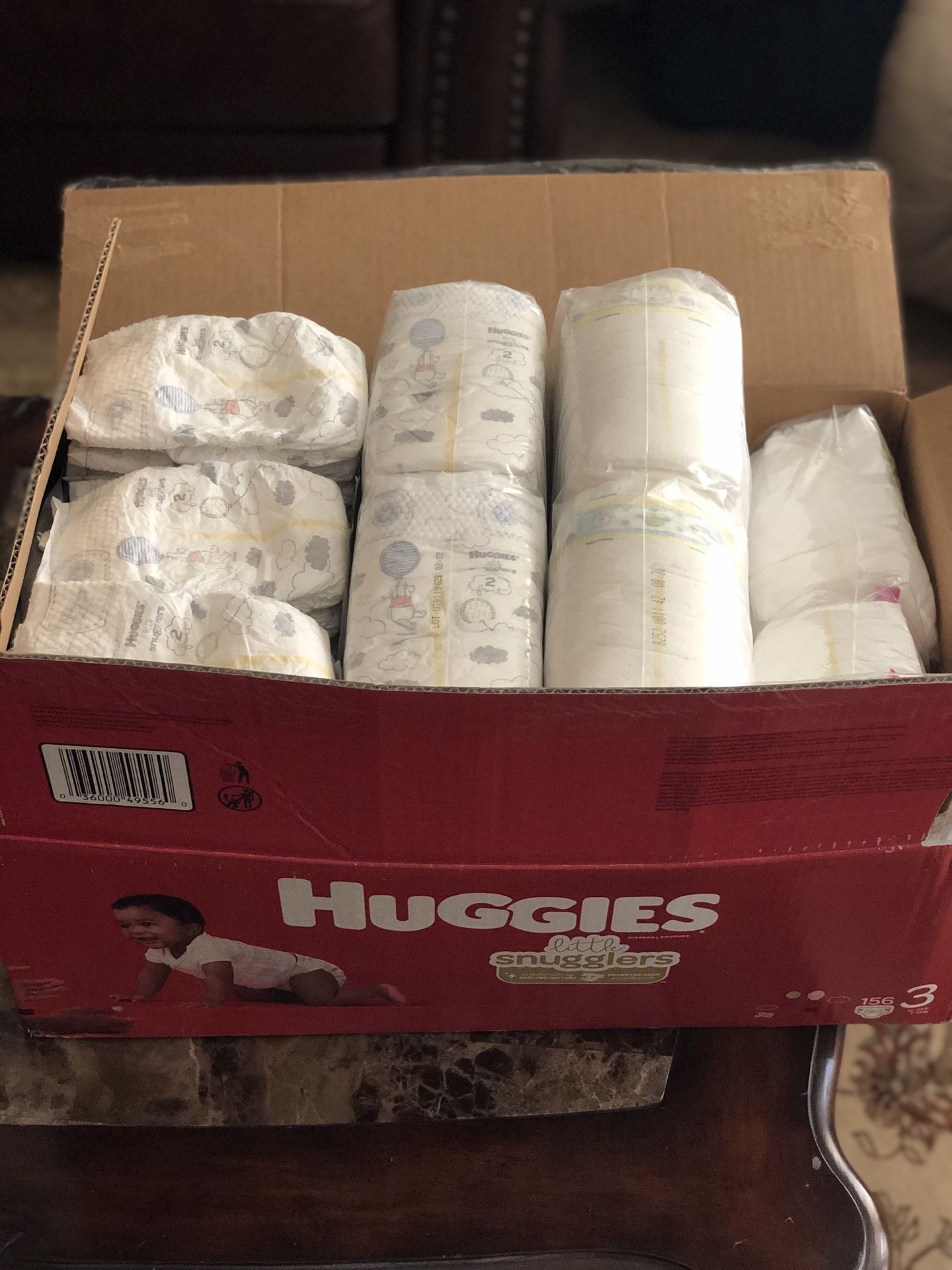 Huggies and Pampers Diapers (size 2)