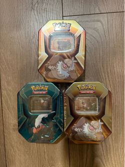 Pokemon TCG Triple Whammy Collector Tins
