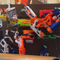 Nerf Guns + Bullets + Peg Board And Pegs