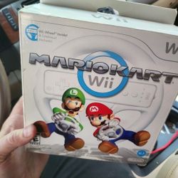 Nintendo wii Mario Kart complete in box with steering wheel 
Excellent Condition. 
