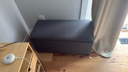 Grey fabric storage ottoman