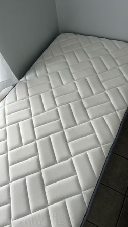 White Quilted Mattress with bed frame twin