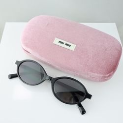 Miu Miu Oval Sunglasses in Black with Gray Lens