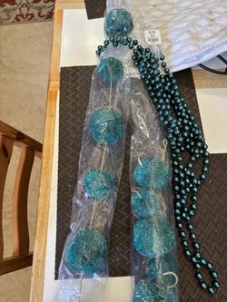 Brand new Christmas garlands in teal