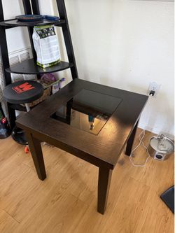 2 wooden side tables glass center