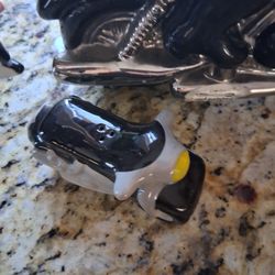 Motorcycle.\nPigs cookie jar