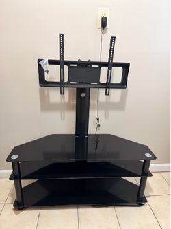 Black glass TV stand with integrated mount