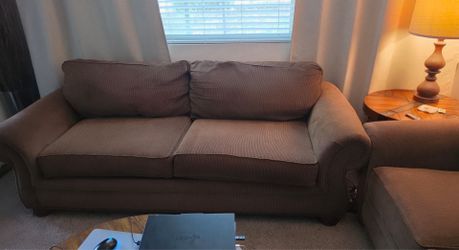 Three used brown couches