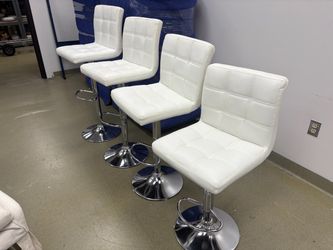 4 white faux leather and chrome adjustable barstools