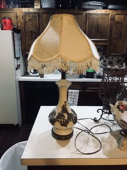 Antiquesa porcelain lamp with iron embellishments