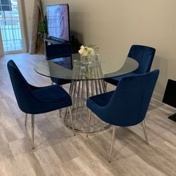 Round Glass Dining Table with Navy Blue Velvet Dining Chairs