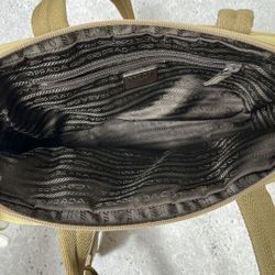 Metal handles nylon 𝐏𝐫𝐚𝐝𝐚   bag with black 𝐏𝐫𝐚𝐝𝐚   lining
