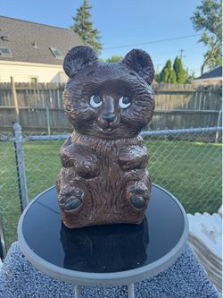 Large brown, bear bank statue