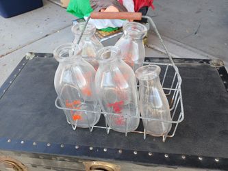 Old Milk Bottles And Carring Gage $35