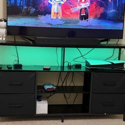 Entertainment center with power outlets and led lights