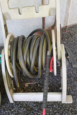 Hose Reel with Garden Hose and Sprayer Attachment