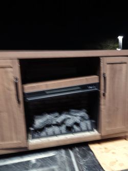 cabinet with a fire effect resembling real coal