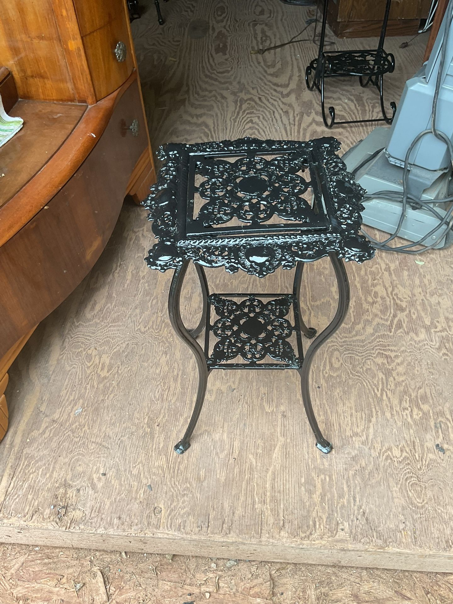 A pretty plant stand it’s 21 inches tall and 12 by 12 inches across the top