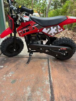 in a frame of a mini buggy 49 cc two-stroke pit bike in a frame of a mini buggy