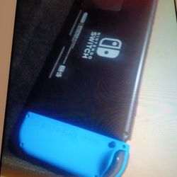 NINTENDO SWITCH 32 GB HAND-HELD CONSOLE NEON RED/ NEON BLUE