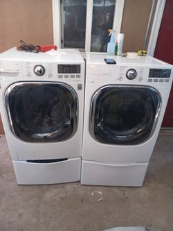 Ls Steam Washer with sidekick pedestal Washer and gas dryer