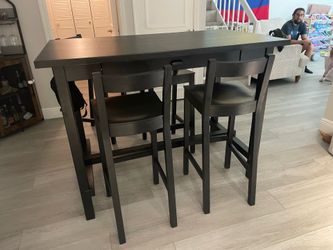 Black high top table with 5 chairs