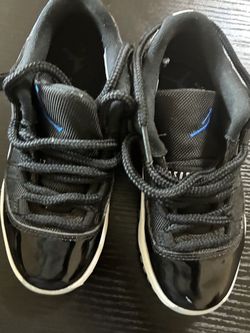 Air Jordan 11 Black Patent Leather Sneakers