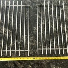 Two brushed nickel trivets.