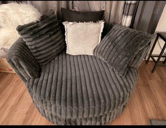 Ashland furniture grey over size couch and a swivel
