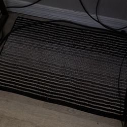 Two Black And White Striped Bath Mats 