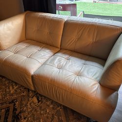 Matching white Leather couch/chair set.