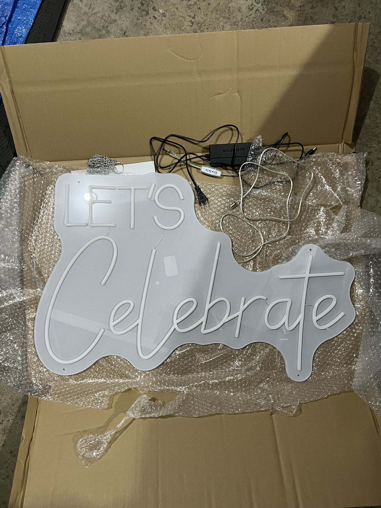 Neon “Let’s Celebrate” Light Sign