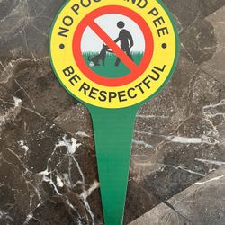 Sign on the lawn: No poop and pee. Be respectful.