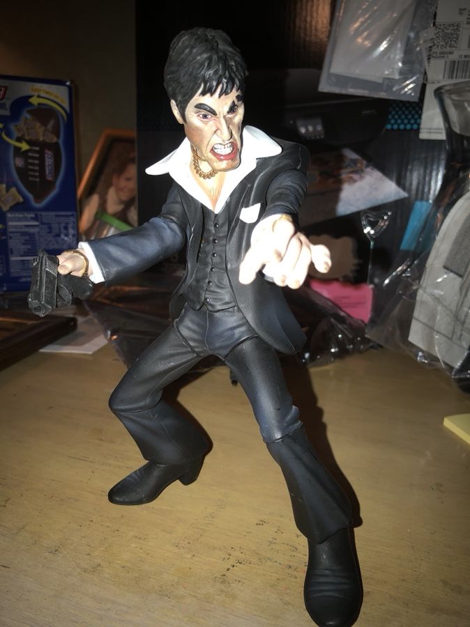 Talking Scarface Tony Montana Al Pacino figurine with handgun.