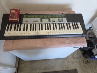 Casio LK-135 keyboard with universal power adapter