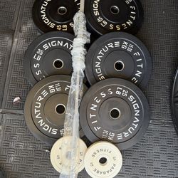 Olympic rubber Olympic weights 230lbs total plus 7ft 45lbs bar