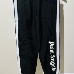 PALM ANGELS OVER LOGO TRACK PANTS IN BLACK 